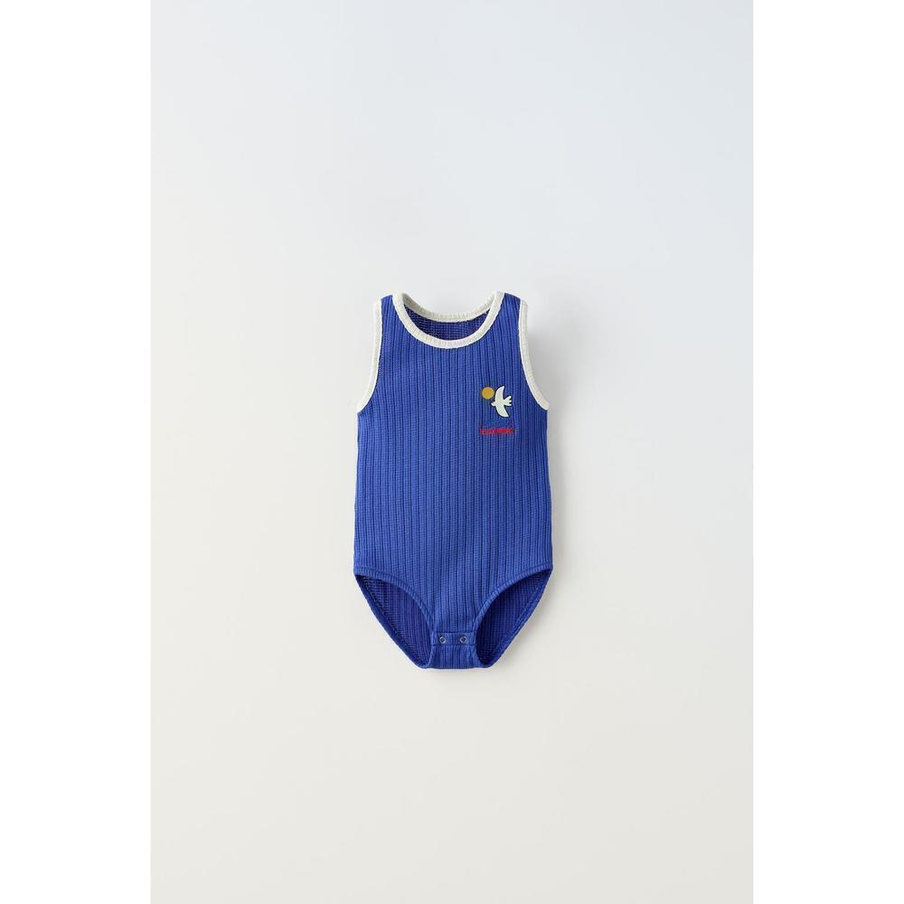 EMBROIDERED PIPED KNIT BODYSUIT
